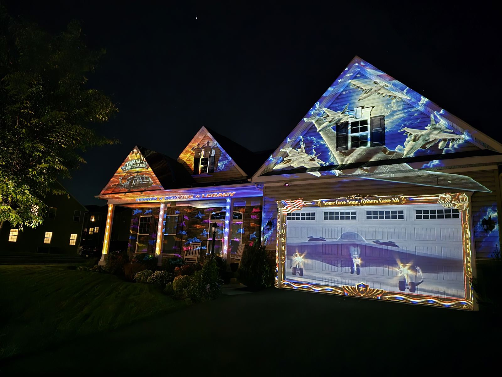 Halloween projection mapping show running on a residential house at night